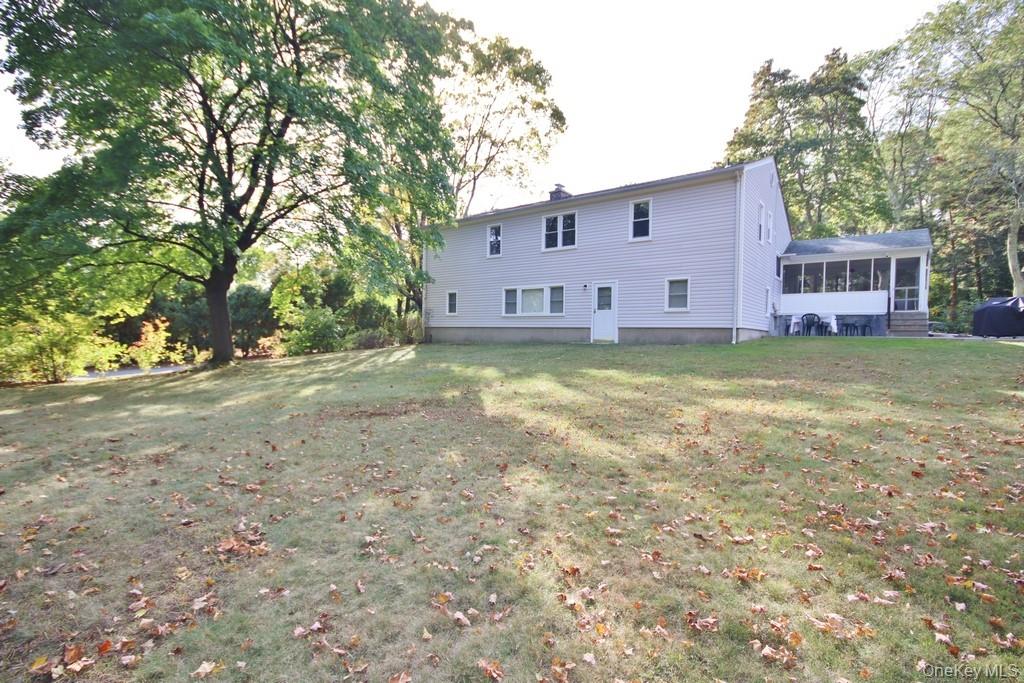 47 Fuller Road Briarcliff Manor, NY 10510 - Photo 31 of 34 a view of a house with backyard and garden