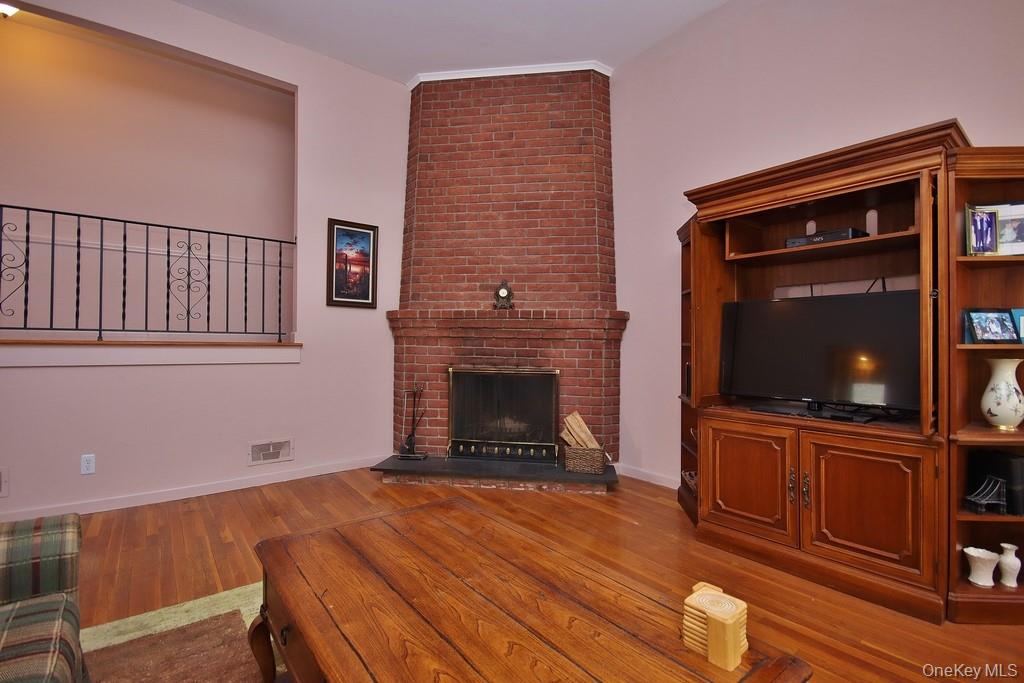 47 Fuller Road Briarcliff Manor, NY 10510 - Photo 8 of 34 Brick fireplace in living room