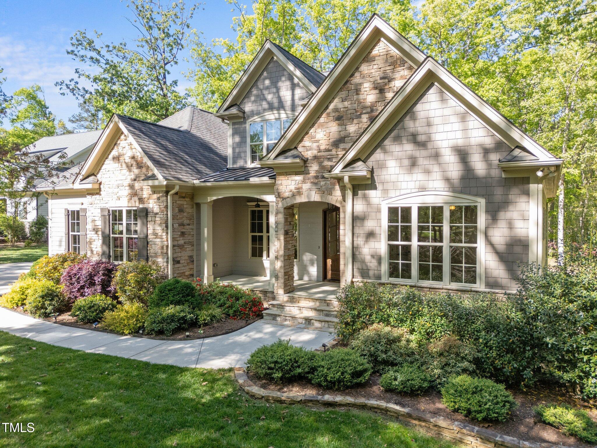 Mature plants enhance this home