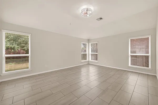 a view of an empty room with a window
