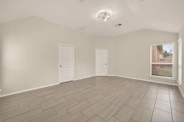 a room with a cabinets and appliances