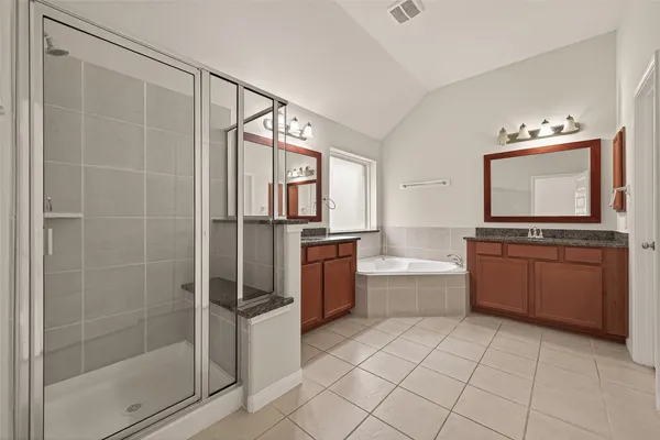 a bathroom with a sink vanity and mirror