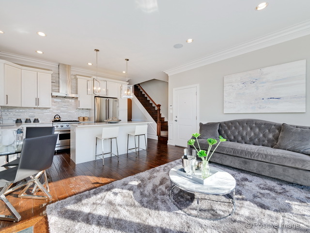 1430 West Fillmore Street, Unit 3W Chicago, IL 60607 - Photo 6 of 17 a living room with furniture and wooden floor