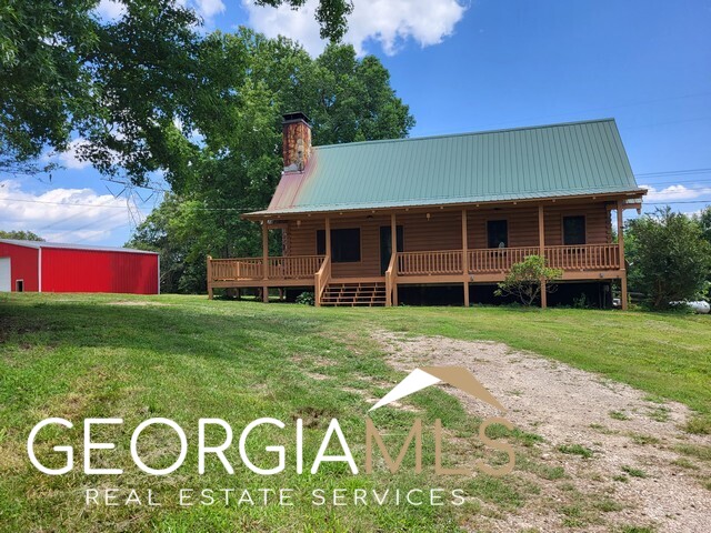 233 Pritchett Road Lula, GA 30554 - Photo 1 of 1 a front view of a house with a yard