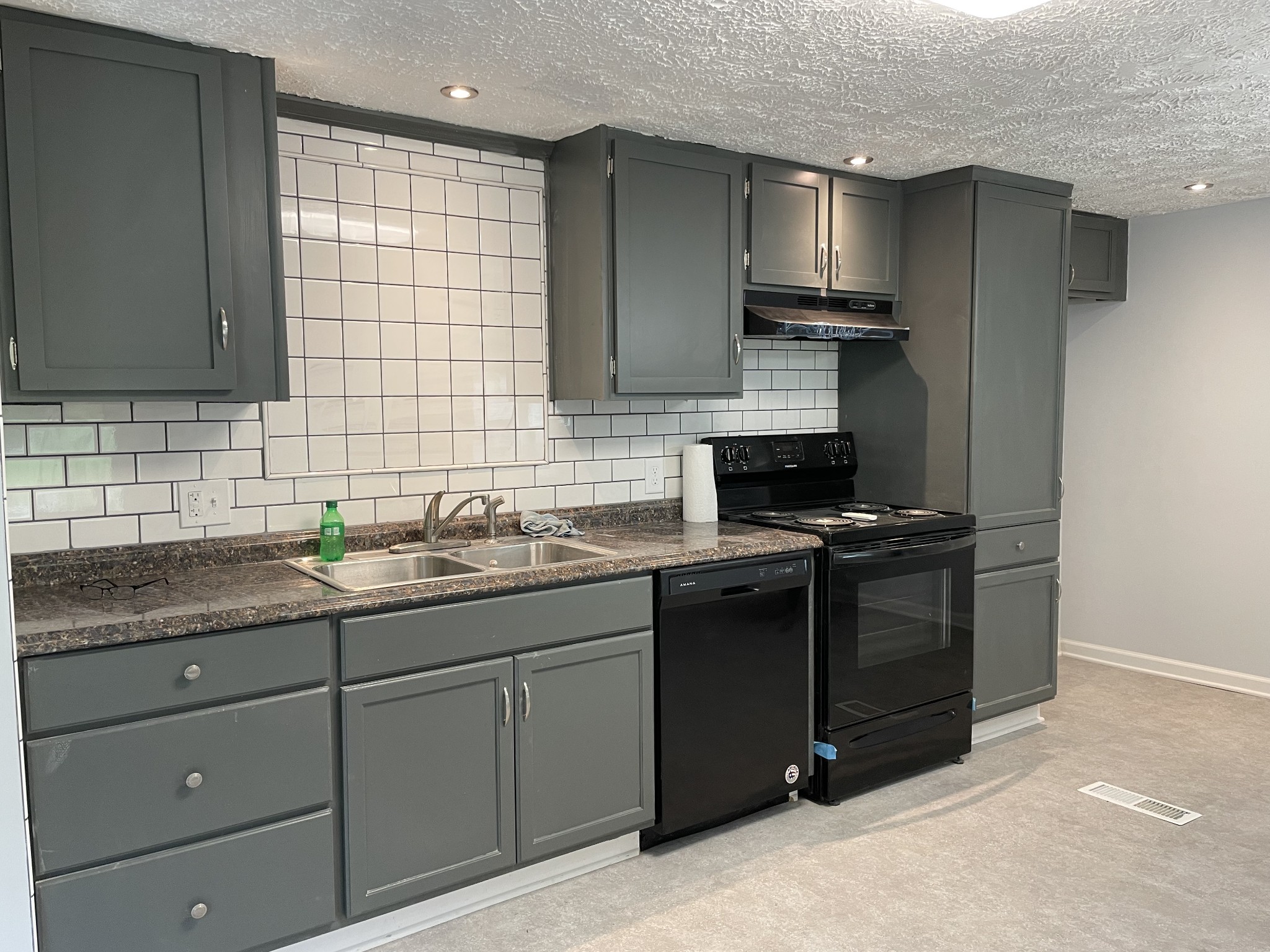 2973 New Bushy Branch Road Manchester, TN 37355 - Photo 1 of 14 a kitchen with a sink stove and cabinets