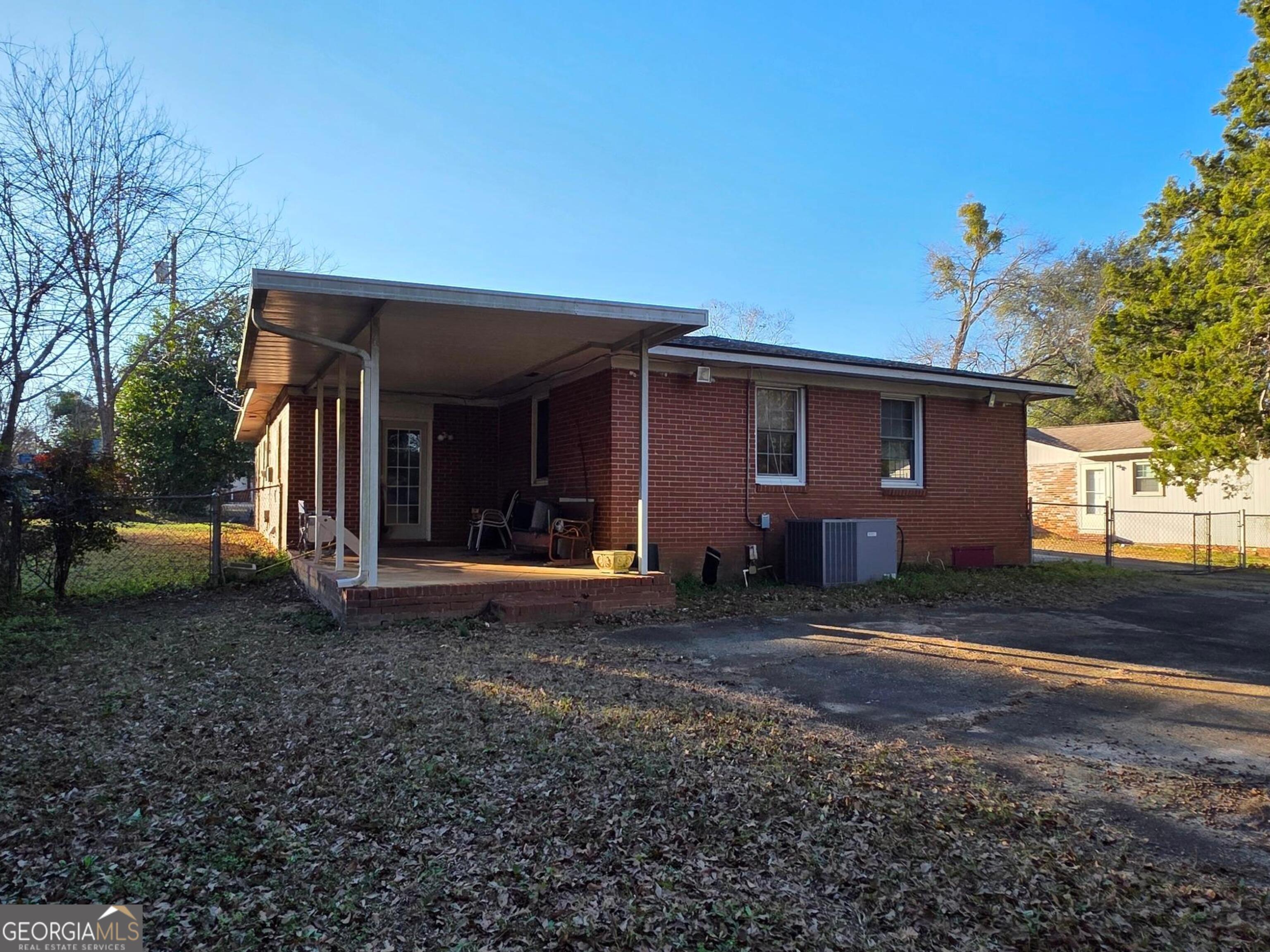 110 Lee Street Centerville, GA 31028 - Photo 14 of 16 a view of a house with backyard and trees