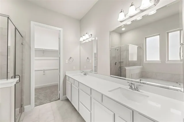 a bathroom with a double vanity sink mirror and double