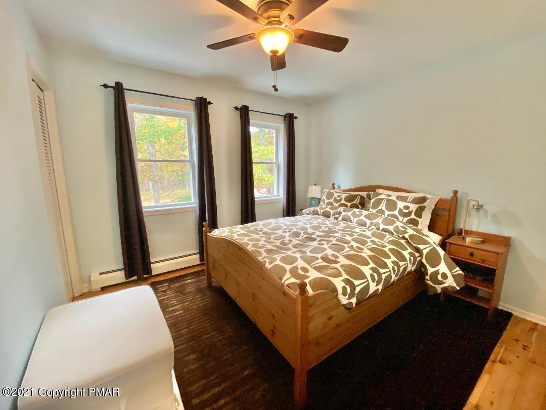 3196 Bobcat Drive Bushkill, PA 18324 - Photo 12 of 24 a bedroom with a bed and window