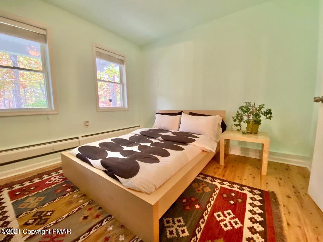 3196 Bobcat Drive Bushkill, PA 18324 - Photo 13 of 24 a bedroom with a bed and a window