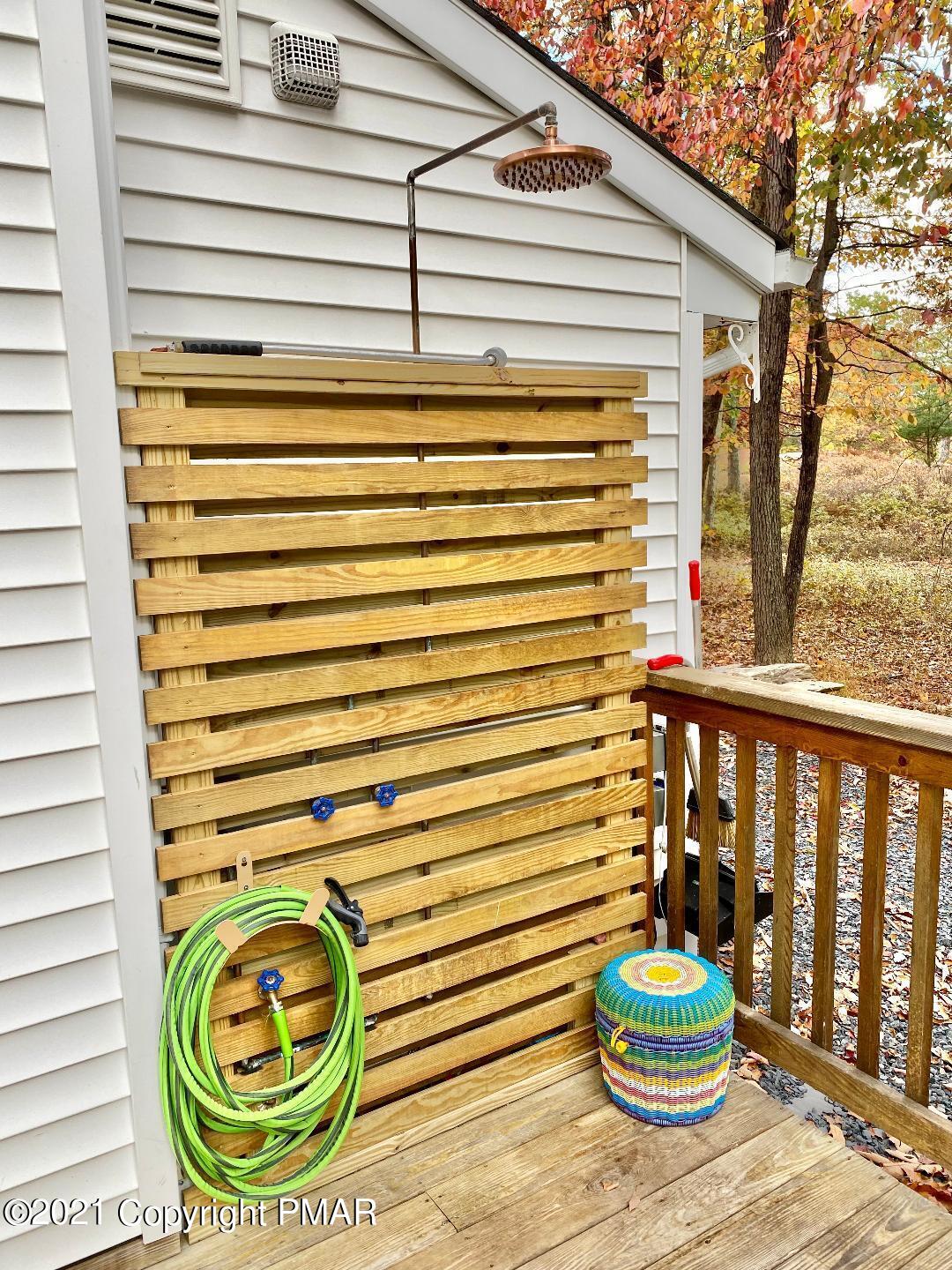 3196 Bobcat Drive Bushkill, PA 18324 - Photo 17 of 24 a bathroom with a sink a mirror and toilet