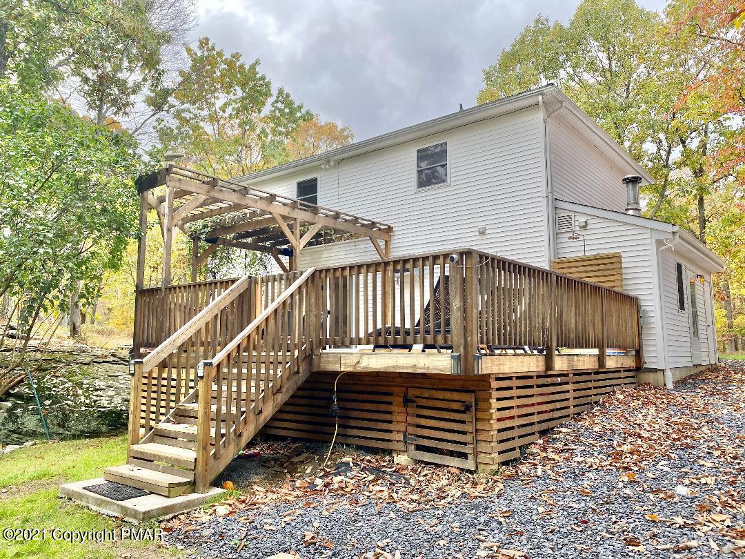 3196 Bobcat Drive Bushkill, PA 18324 - Photo 20 of 24 a view of a house with a yard next to a road