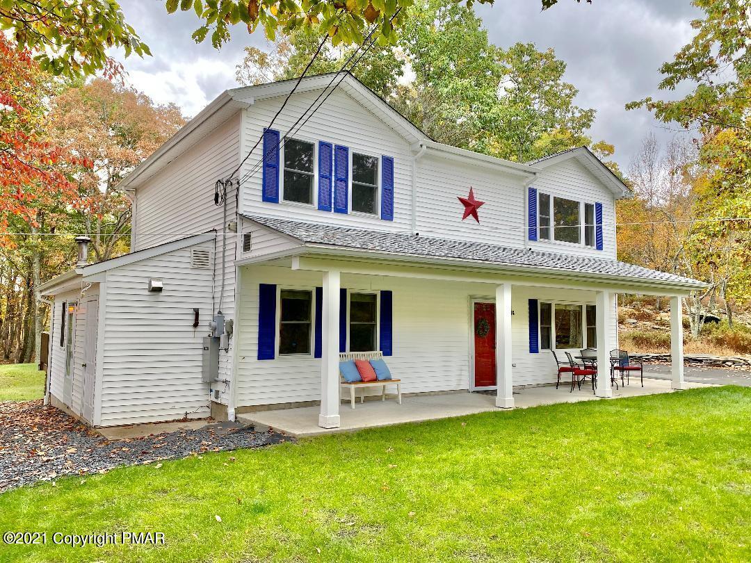 3196 Bobcat Drive Bushkill, PA 18324 - Photo 2 of 24 a front view of a house with a yard