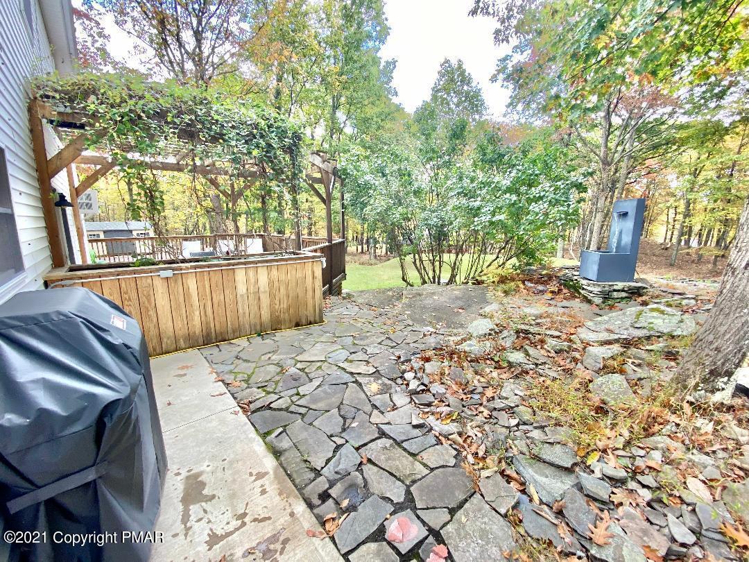 3196 Bobcat Drive Bushkill, PA 18324 - Photo 23 of 24 a view of backyard with wooden fence and large trees