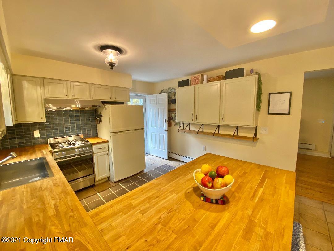 3196 Bobcat Drive Bushkill, PA 18324 - Photo 3 of 24 a kitchen with a sink and refrigerator