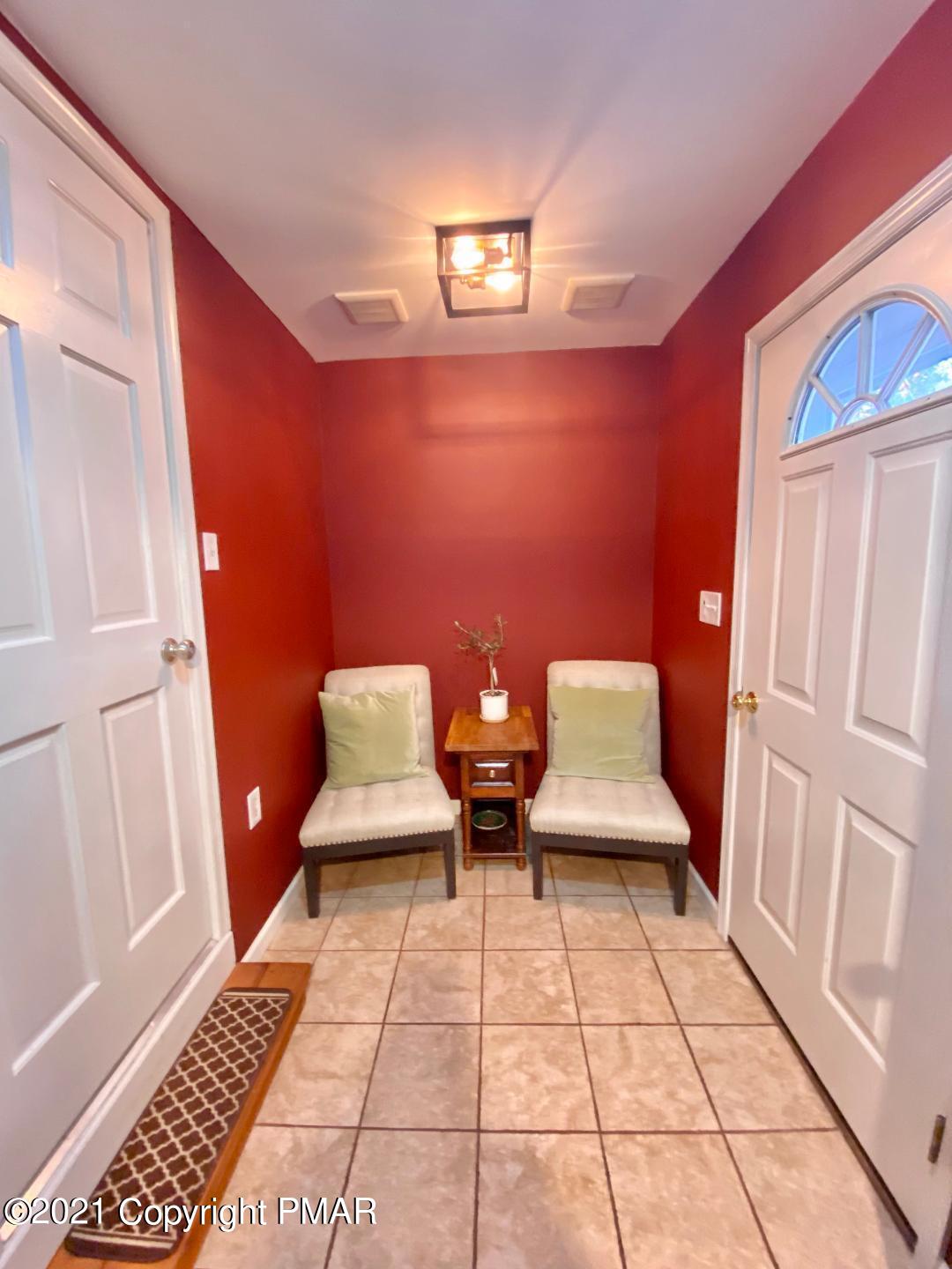 3196 Bobcat Drive Bushkill, PA 18324 - Photo 8 of 24 a living room with hard wood flooring and a couch