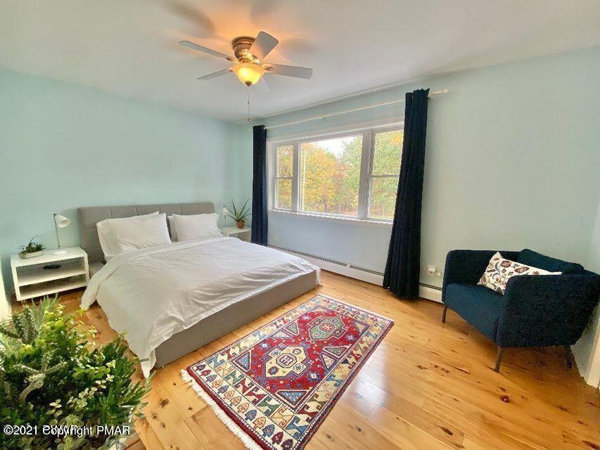 3196 Bobcat Drive Bushkill, PA 18324 - Photo 9 of 24 a bed sitting in a bedroom next to a window