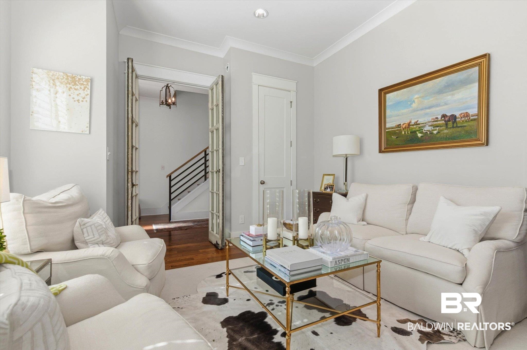 3704 Stein Street Mobile, AL 36608 - Photo 5 of 37 Living room featuring wood finished floors, ornamental molding, and stairway