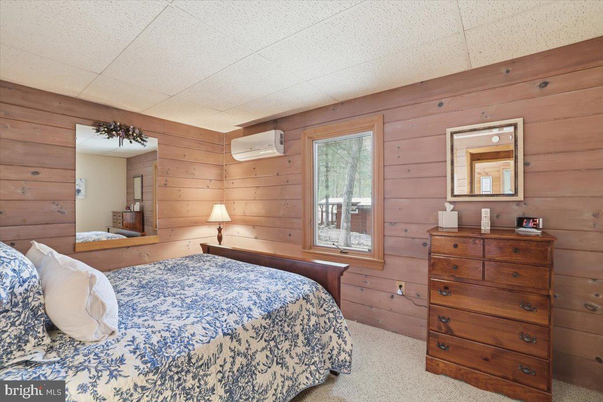 15 Hazard Run Road Lake Harmony, PA 18624 - Photo 13 of 46 a bedroom with a bed and wooden floor