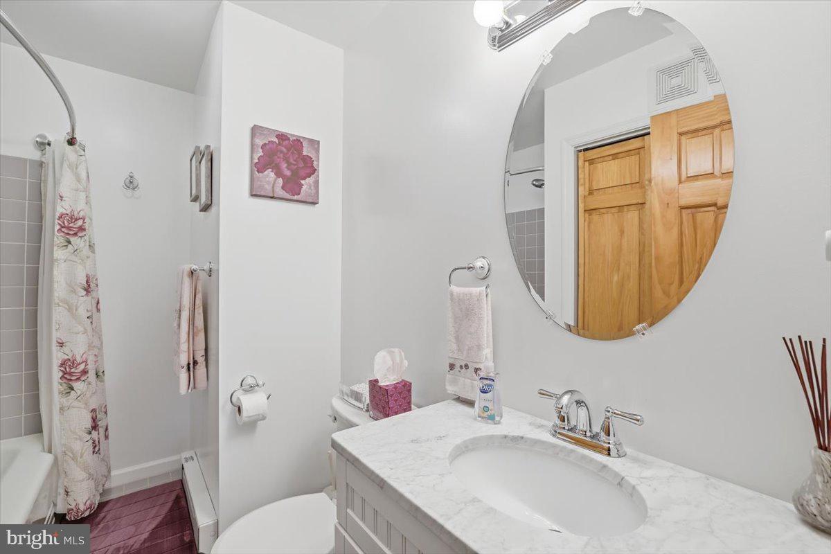15 Hazard Run Road Lake Harmony, PA 18624 - Photo 15 of 46 a bathroom with a granite countertop toilet a sink and a mirror