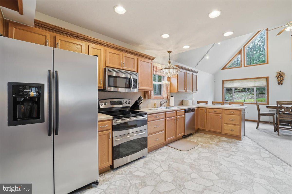 15 Hazard Run Road Lake Harmony, PA 18624 - Photo 23 of 46 a kitchen with a refrigerator and a sink