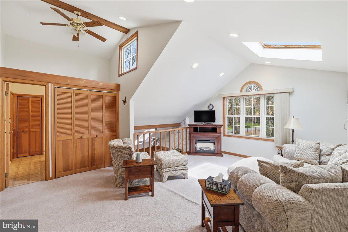 15 Hazard Run Road Lake Harmony, PA 18624 - Photo 35 of 46 a living room with furniture a ceiling fan and a window