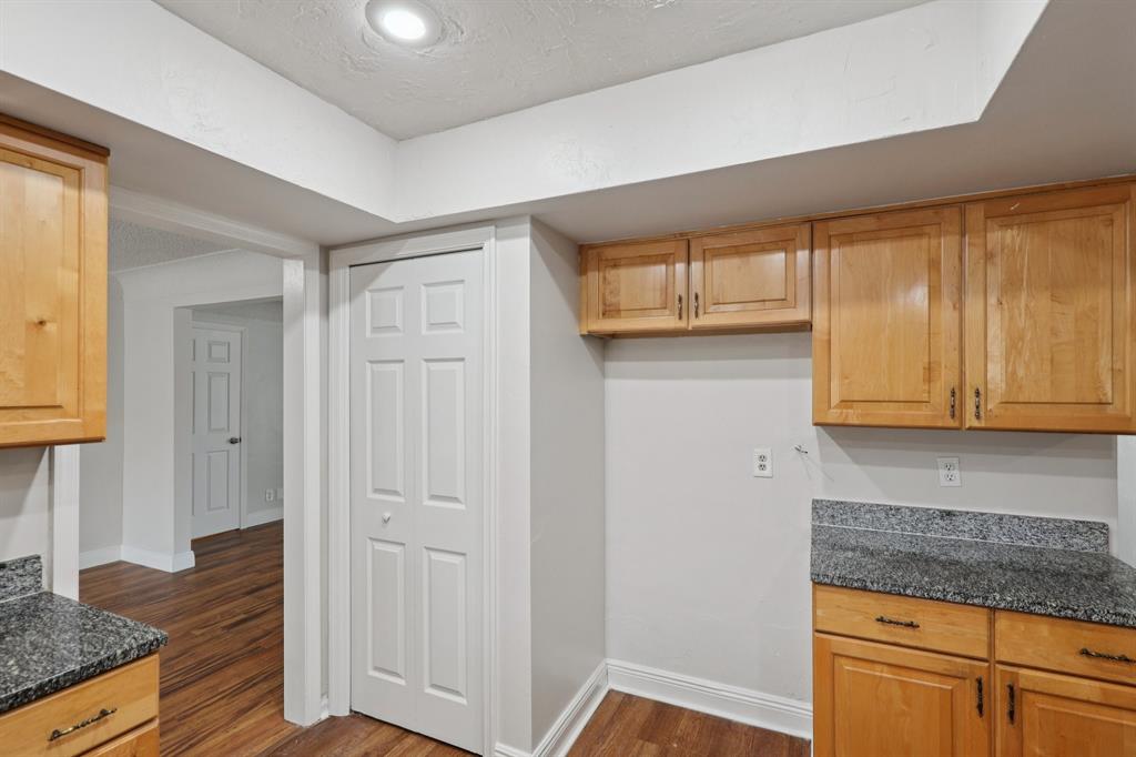 1541 Northwest 9th Street Boca Raton, FL 33486 - Photo 28 of 63 a kitchen with granite countertop cabinets and window
