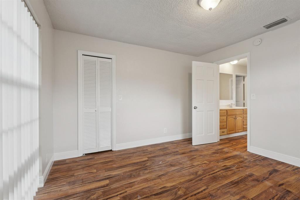 1541 Northwest 9th Street Boca Raton, FL 33486 - Photo 33 of 63 a view of an empty room with wooden floor