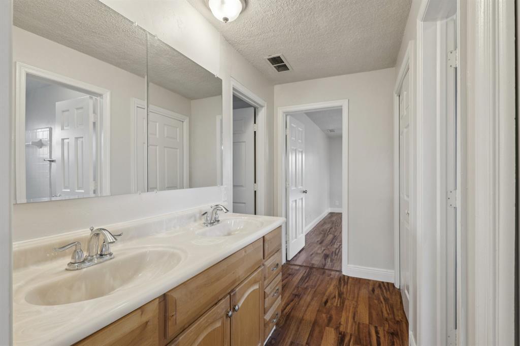 1541 Northwest 9th Street Boca Raton, FL 33486 - Photo 36 of 63 a en suite bathroom with a double vanity sink and mirror