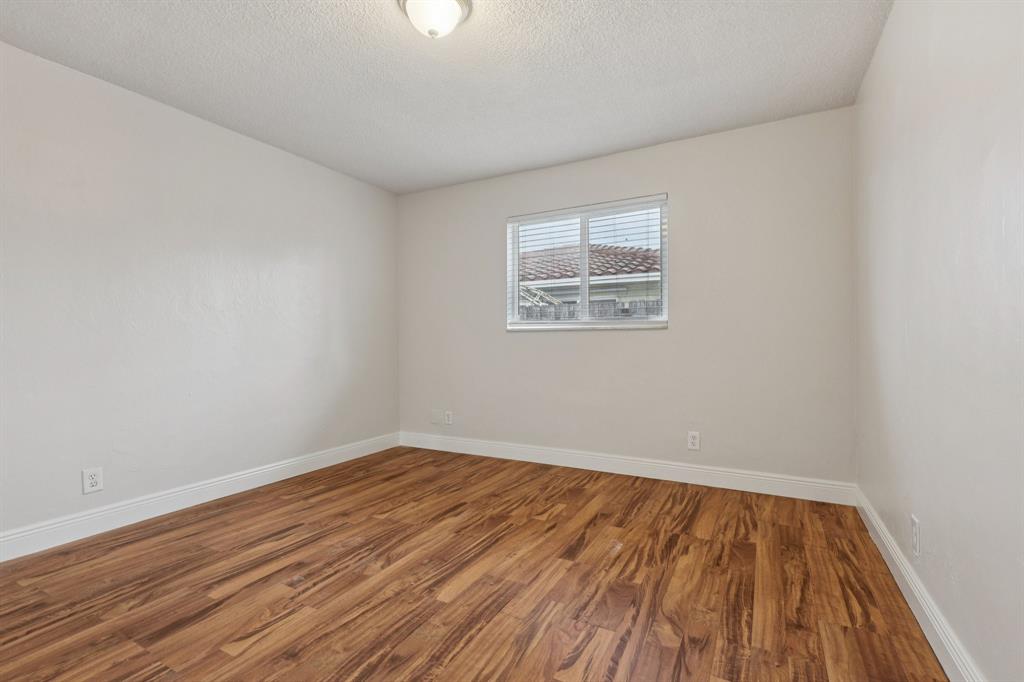 1541 Northwest 9th Street Boca Raton, FL 33486 - Photo 46 of 63 an empty room with wooden floor and windows