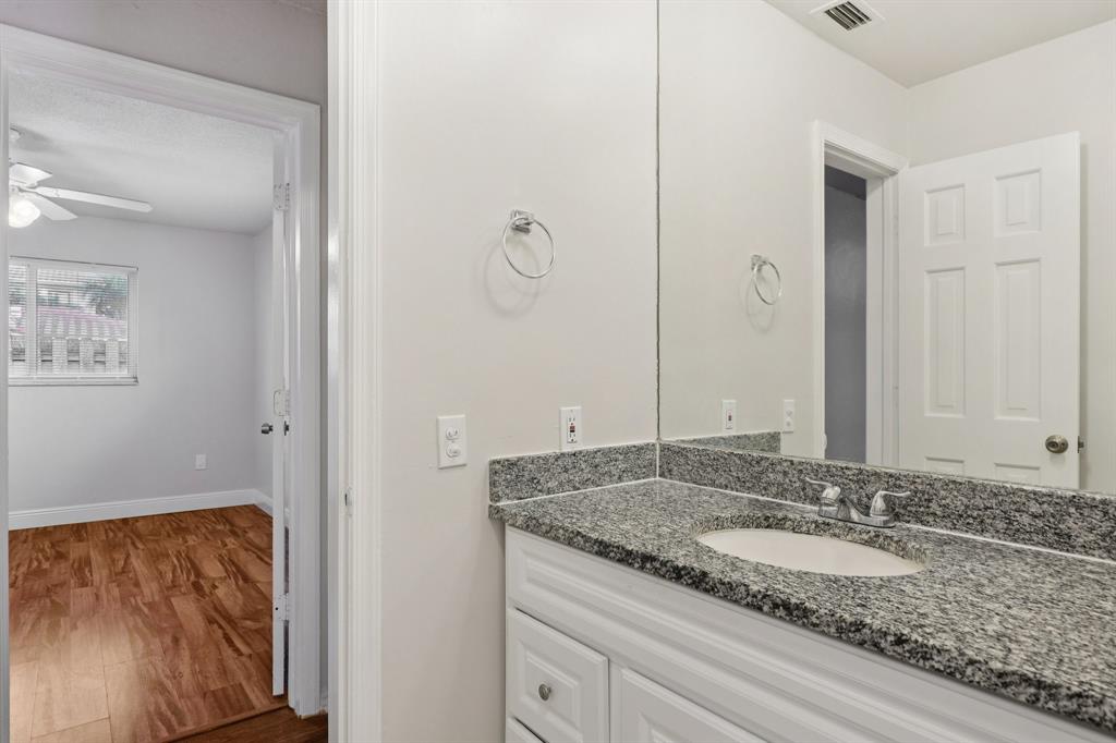 1541 Northwest 9th Street Boca Raton, FL 33486 - Photo 50 of 63 a bathroom with a granite countertop sink and a mirror