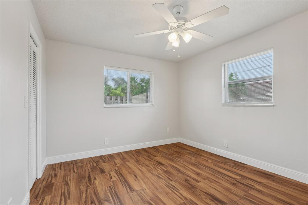 1541 Northwest 9th Street Boca Raton, FL 33486 - Photo 53 of 63 a view of a room with wooden floor and window