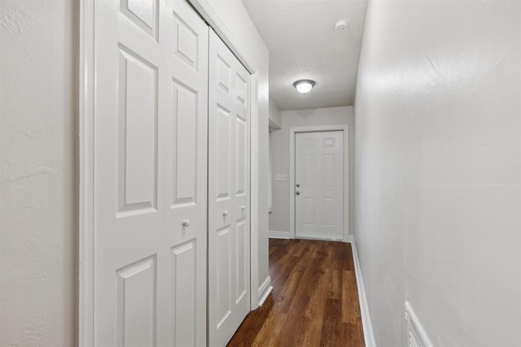 1541 Northwest 9th Street Boca Raton, FL 33486 - Photo 55 of 63 a view of a hallway with wooden floor and staircase