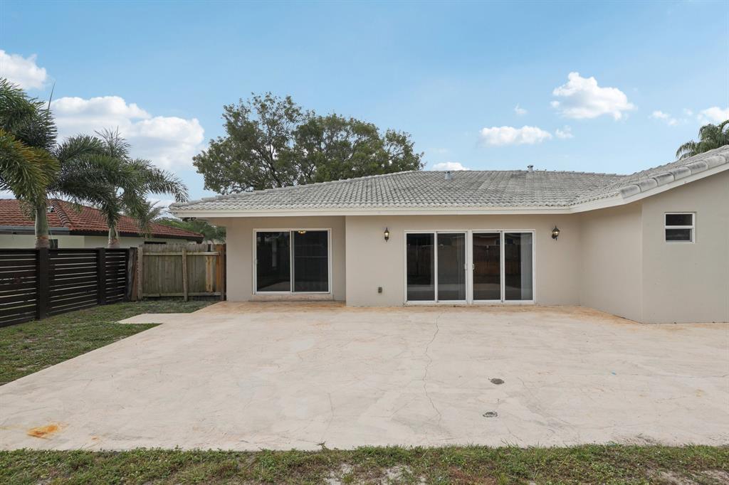 1541 Northwest 9th Street Boca Raton, FL 33486 - Photo 58 of 63 front view of a house with a yard