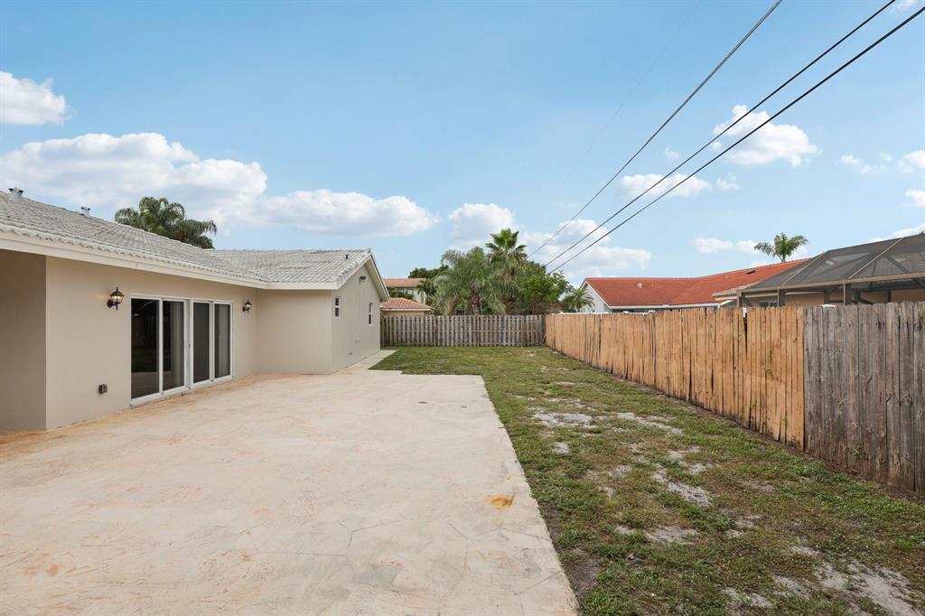 1541 Northwest 9th Street Boca Raton, FL 33486 - Photo 59 of 63 a view of a backyard of the house