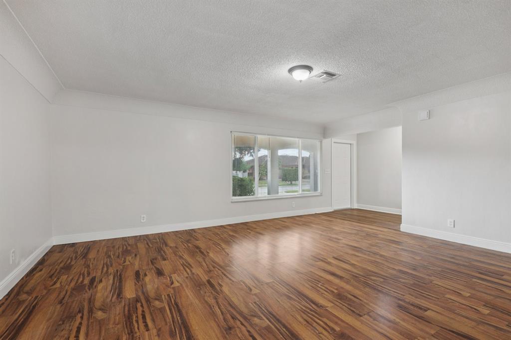 1541 Northwest 9th Street Boca Raton, FL 33486 - Photo 10 of 63 a view of empty room with wooden floor and fan