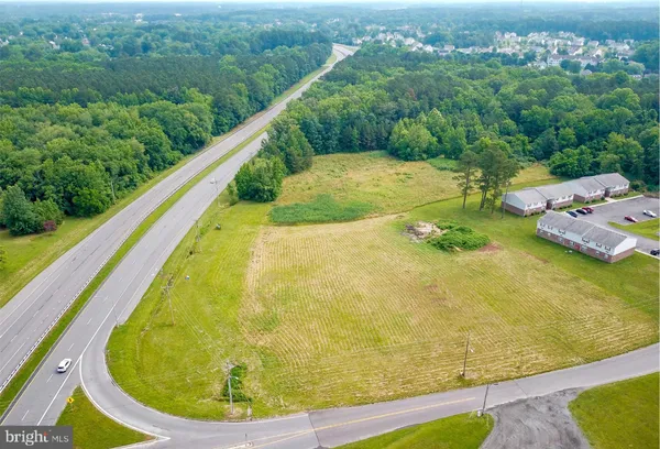 a view of a swimming pool with a yard