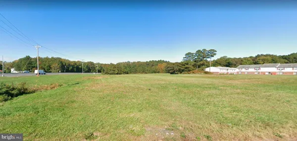 a view of a lake with a big yard