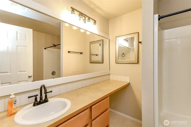 a white toilet sitting next to a bath tub