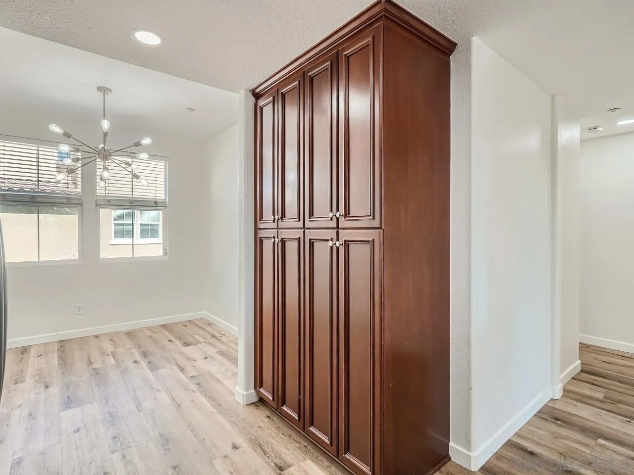 10225 Daybreak Lane, Unit 5 Santee, CA 92071 - Photo 13 of 27 a view of a hallway with wooden floor and staircase