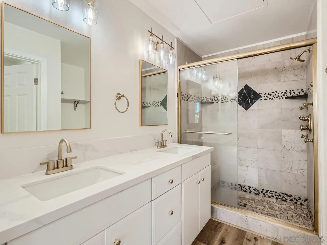 10225 Daybreak Lane, Unit 5 Santee, CA 92071 - Photo 23 of 27 a bathroom with a sink and a mirror