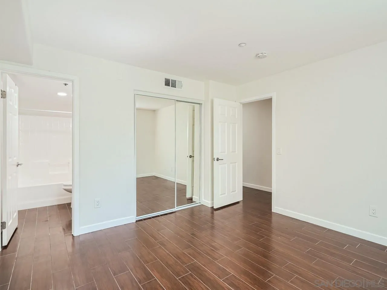 10225 Daybreak Lane, Unit 5 Santee, CA 92071 - Photo 6 of 27 a view of an empty room with wooden floor