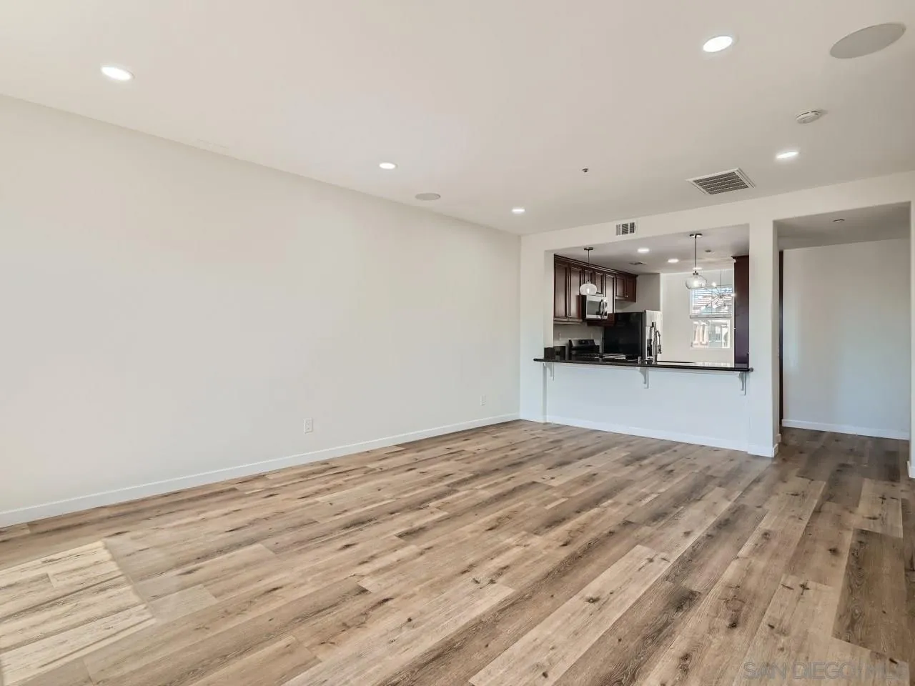 10225 Daybreak Lane, Unit 5 Santee, CA 92071 - Photo 10 of 27 a view of a kitchen with a sink and a refrigerator