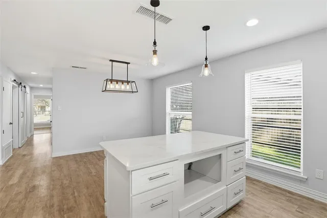 a kitchen with a stove and a refrigerator
