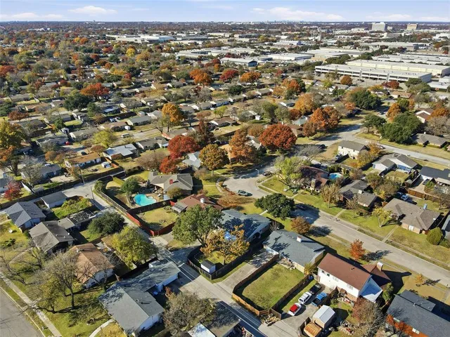 an aerial view of a city with lots of residential buildings