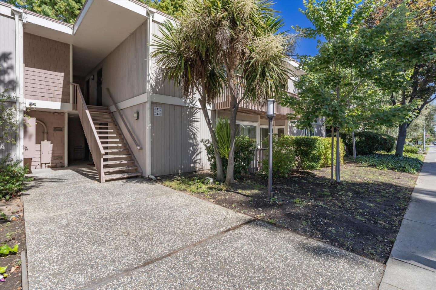 280 Easy Street, Unit 113 Mountain View, CA 94043 - Photo 13 of 22 a view of a house with a yard