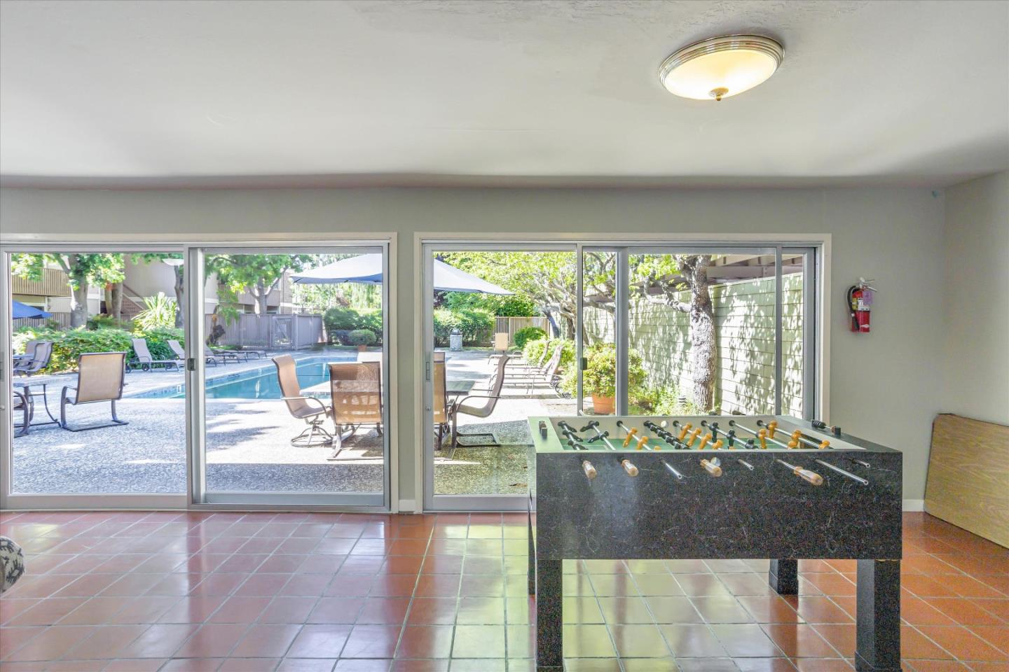 280 Easy Street, Unit 113 Mountain View, CA 94043 - Photo 18 of 22 a living room with hardwood floor and a large window