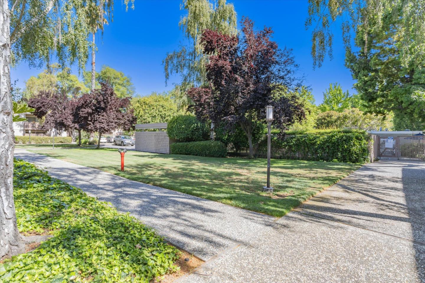 280 Easy Street, Unit 113 Mountain View, CA 94043 - Photo 20 of 22 a view of a road with a houses in the background