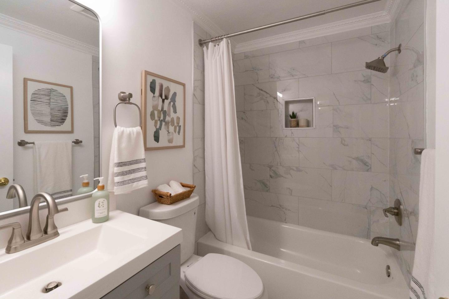 280 Easy Street, Unit 113 Mountain View, CA 94043 - Photo 8 of 22 a bathroom with a sink toilet tub and shower