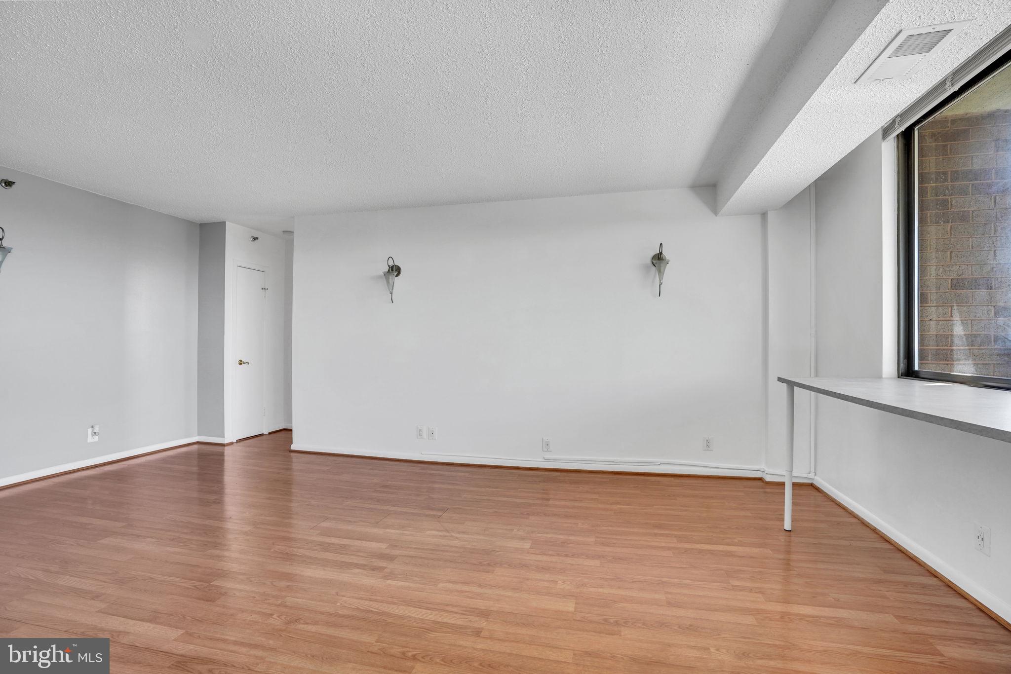 5501 Seminary Road, Unit 1908S Falls Church, VA 22041 - Photo 15 of 43 a view of an empty room with wooden floor and a window
