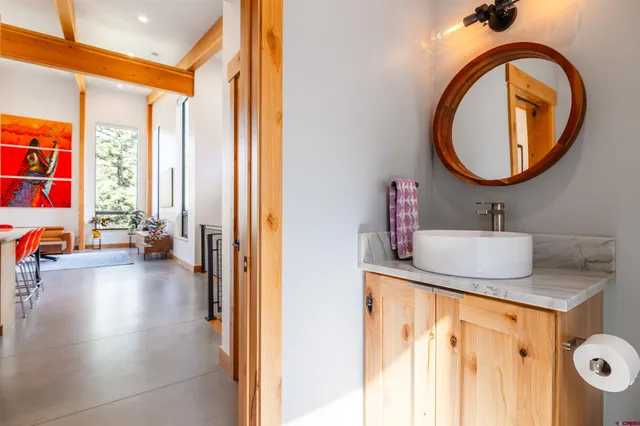 a bathroom with a sink and a mirror